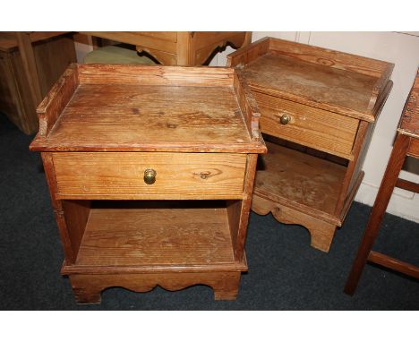 A pair of pine bedside cabinets with gallery top and drawer, and open shelf base, 50cm