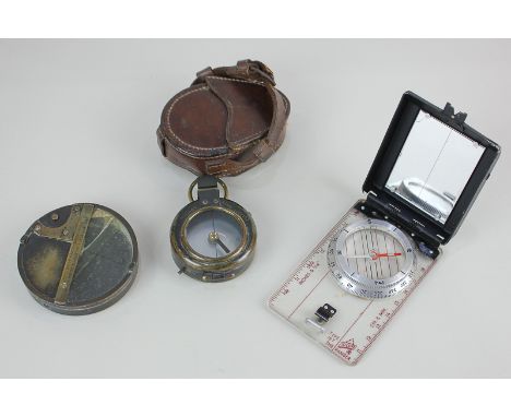 A pocket compass in brass case marked Elliott Bros London, with a suspension loop, 5.4cm, in fitted leather case, together wi