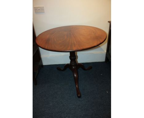 A 19th century mahogany occasional tripod table with circular tilt-top, on baluster turned stem and outswept legs, 84cm