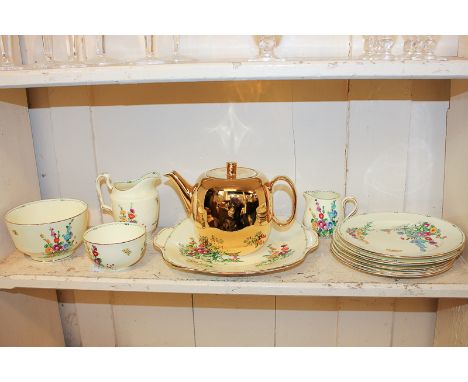 An early 20th century Crown Staffordshire part tea and coffee service in Pan pattern, together with a Royal Worcester flame p