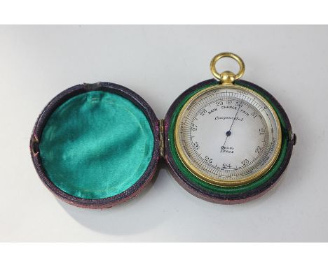 A pocket aneroid barometer with silvered dial signed Davis Leeds, in brass case with a suspension hoop, 4.9cm, in fitted leat