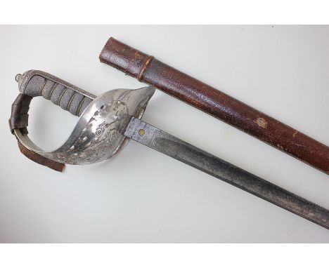 A George VI World War Two Infantry officer's sword in leather scabbard (a/f) with pierced guard and shagreen grip