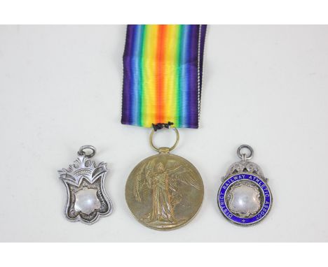 A First World War Victory medal awarded to G-70225 PTE. F. KREUSE. MIDD'X R, together with two silver medals, one with blue e