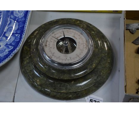 A SERPENTINE CIRCULAR ANEROID BAROMETER, diameter approximately 20cm