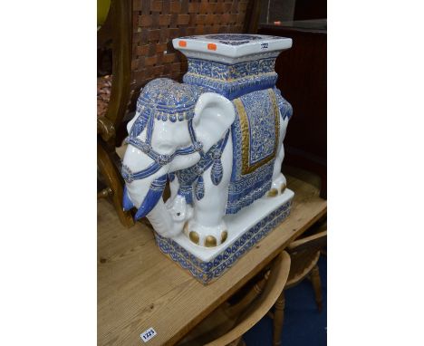 A GLAZED CERAMIC STOOL IN THE FORM OF AN ELEPHANT