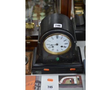 A LATE 19TH CENTURY BLACK SLATE DOME TOP MANTEL CLOCK, enamel dial, with pendulum and later keys, height 26cm