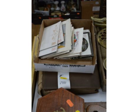 A POSTCARD ALBUM, loosely inserted and a quantity of loose cards, to include WWI items, Edwardian and early 20th Century Brit