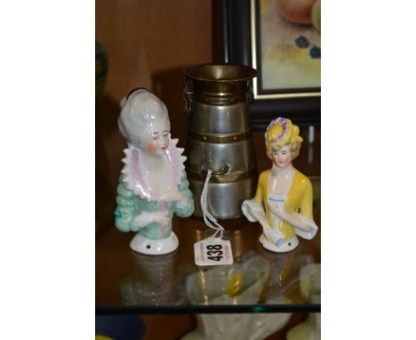 A NOVELTY MONEY BANK, shaped as milk churn (a.f), together with two pin cushion dolls (3)