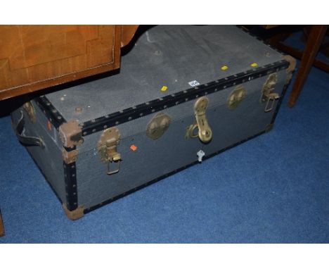 A VINTAGE TRAVELLING TRUNK (key)
