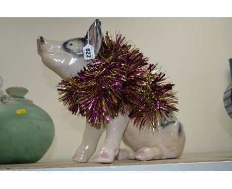 A CERAMIC FIGURE OF A SEATED PIGLET, height 32cm