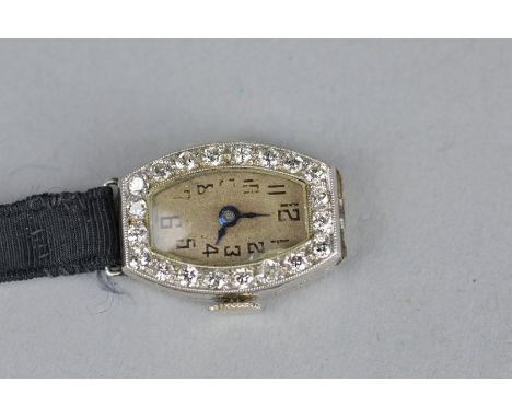 AN ART DECO LADIES DIAMOND SET PLATINUM CASED COCKTAIL WATCH, champagne dial with black Arabic numerals, twenty small round b
