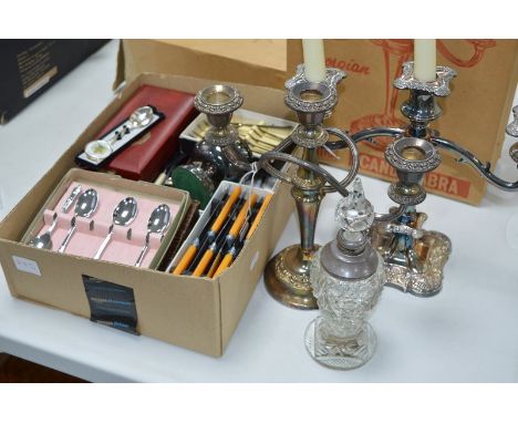 A QUANTITY OF PLATED WARE, to include two boxed candelabras, various flatware and a silver topped scent bottle
