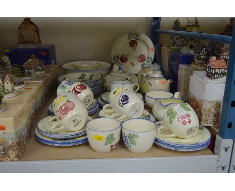 A POOLE POTTERY HAND PAINTED BREAKFAST SET, stencilled fruit design, including tea pots, bowls, jugs, etc, s.d. (over 50 piec