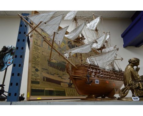 A WOODEN MODEL OF A THREE MAST GUN SHIP, on wooden stand, approximate height 79cm x length 106cm, together with a nautical in