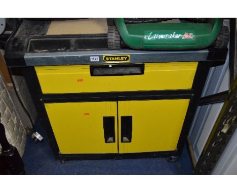 A STANLEY WORKBENCH WITH A BENCH GRINDER ATTACHED