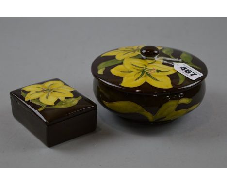 TWO PIECES MOORCROFT POTTERY, yellow 'Bermuda Lily' pattern on brown ground, to include powder bowl (covered) and rectangular