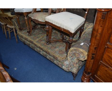 A VICTORIAN UPHOLSTERED TWO SEATER SOFA