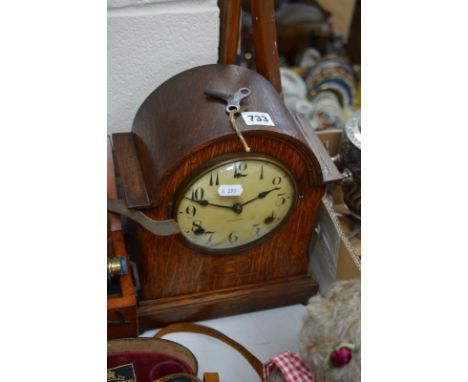 AN EARLY 20TH CENTURY OAK CASED DOME TOP MANTEL CLOCK, together with an oak cased aneroid barometer (2)
