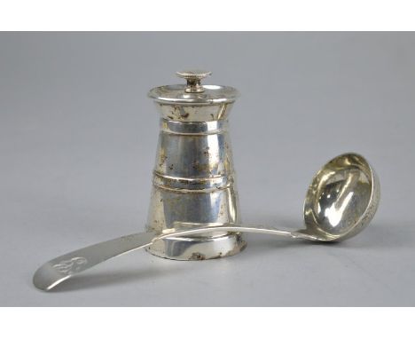 A SILVER PEPPER MILL OF LIGHTHOUSE FORM, Hukin & Heath Ltd, Birmingham 1937, together with a silver sauce ladle, Glasgow 1846