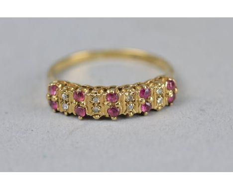 A RUBY AND DIAMOND TWO ROW 9CT YELLOW GOLD CLUSTER RING, ring size N 1/2, approximate gross weight 2.1 grams