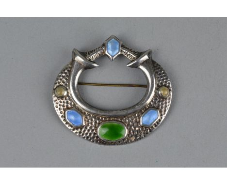 A MID 20TH CENTURY SILVER ENAMELLED BROOCH, the raised oval, circular and hexagonal beige, green and blue enamel sections, ru