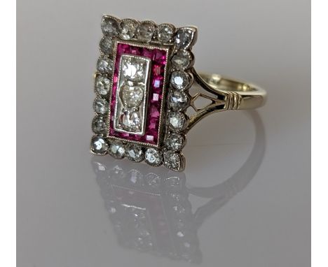 An Art Deco diamond and ruby platform ring on an 18ct yellow gold setting, stamped, platform 15x10mm, the three central old-c