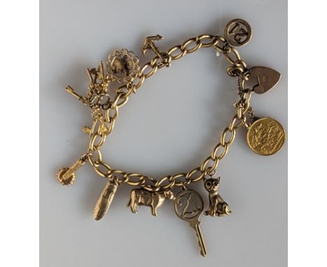 A 9ct yellow gold charm bracelet with assorted gold charms, including a George V half gold sovereign, 1915, 44g