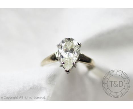 A pendeloque diamond ring, the single diamond (measuring approximately 1.75ct) within five claw setting to the tapering shoul