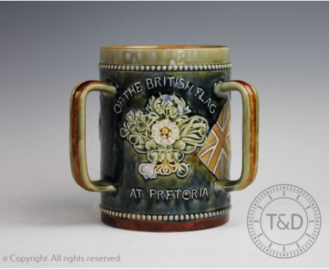 A large Doulton Lambeth stoneware Boer War commemorative tyg, titled 'In Commemoration of the Hoisting of the Flag at Pretori