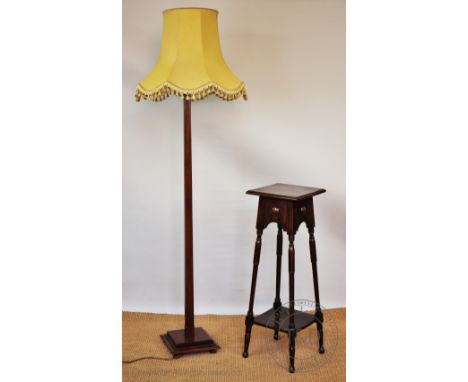 A stained beech standard lamp, 151cm H, with a 1920's oak jardiniere stand (2) CONDITION REPORT: Lighting lots are sold as de