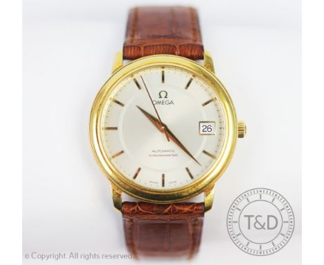 An 18ct gold cased Omega Automatic Chronometer wristwatch, the 18ct gold case enclosing silvered dial with batons, centre swe