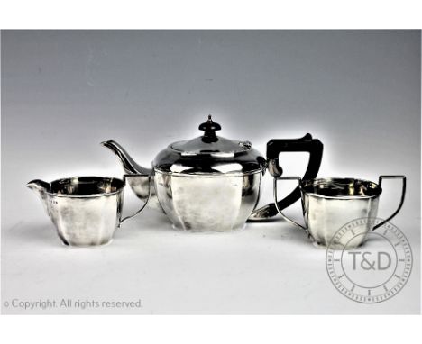A George V three piece silver tea service, A J Bailey, Birmingham 1933/4 comprising; a teapot, twin handled sugar bowl and mi