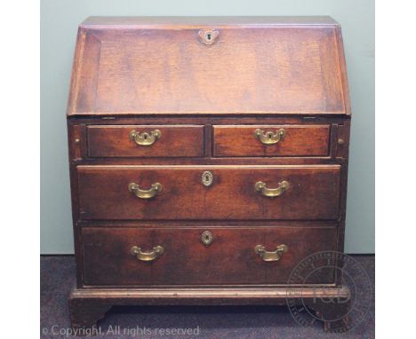 A George III oak bureau, with fall enclosing a fitted interior, over two short and two long drawers, on bracket feet, 97cm H 