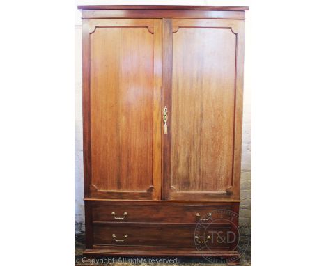 A 19th century mahogany wardrobe, with two doors above a long drawer, on bracket feet, 198cm H x 125cmm W x 50cm D