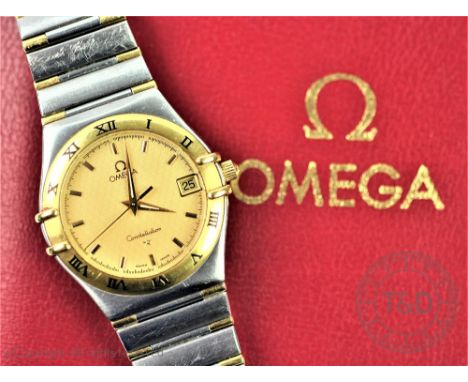 An Omega Constellation bi-metal wristwatch, the circular dial with yellow metal bezel detailed with Roman numerals, enclosing