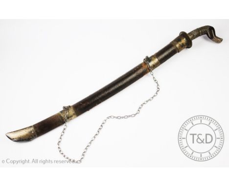 A Malaysian white metal mounted short sword, late 19th / early 20th century, with 58cm blade, white metal mounted wood grip a