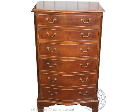 A reproduction mahogany serpentine pillar chest, with six graduated long drawers, on bracket feet, 103cm H x 61cm W x 47cm D