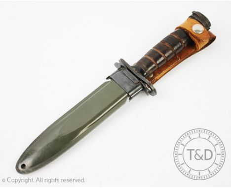 A 'US military bayonet dagger, 16.5cm spear point blade, leather grip and scabbard stamped U.S. M8A1 (2)  CONDITION REPORT: U