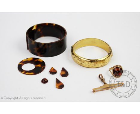 A yellow metal fob stamped '9ct', weight 5gms, an 'amber' set 9ct gold ring, weight 4.6gms, a gold plated hinged bangle and a