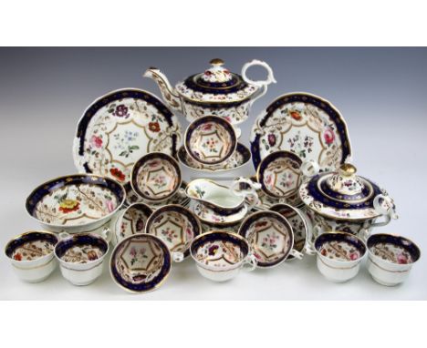 A mid 19th century part tea service, possibly Coalport, of shaped form and decorated with flowers with gilt detailing and blu
