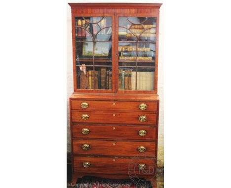 A Regency mahogany secretaire bookcase, with two astragal glazed doors above three long drawers, on splayed bracket feet, 212