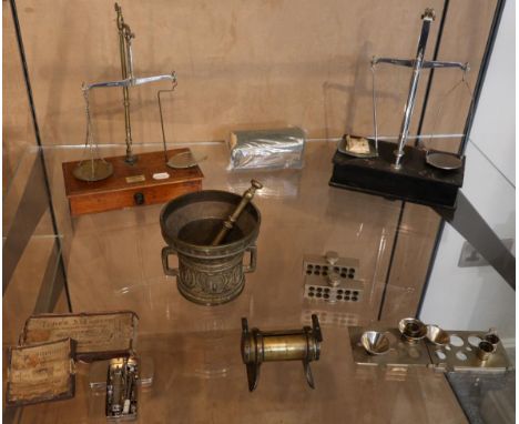 A Collection of Pharmacy Items, including two sets beam scales, pestle & mortars etc
