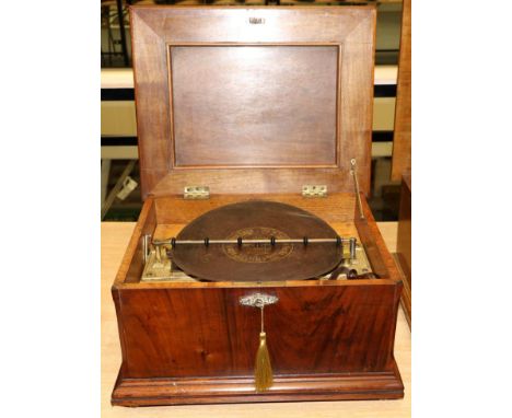 Symphonium (?) Disc Music Box playing 11.75'' discs, twin combs with brass 'Schutz-Marke' star wheel mounts, in walnut cabine