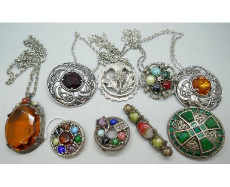 A collection of Scottish and Celtic style brooches and pendants with chains 