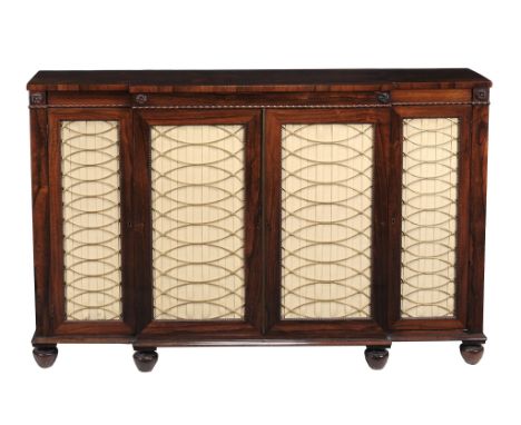  A George IV rosewood breakfront side cabinet  , circa 1825, the frieze with beaded edge and flower motifs above brass grill 