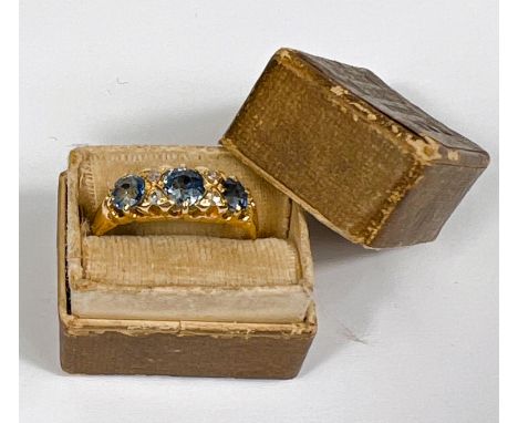 An 18ct hallmarked gold gypsy style ring set with 3 round sapphires and 4 small diamonds in between, L 1/2 (L/M), 2.9gm 