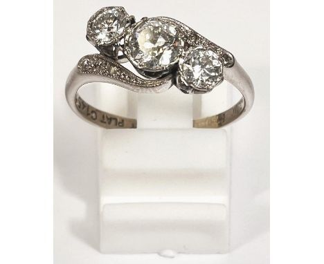 A white&nbsp; metal 3 stone diamond cross over dress ring, stamped 18ct Plat, centre stone approx 5.5mm, size O, 3.5gm 