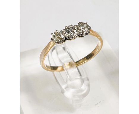 A yellow metal ring stamped 18ct set with 3 diamonds, 1.6gm, size M-N, diamonds approx. 3.5mm diameter 