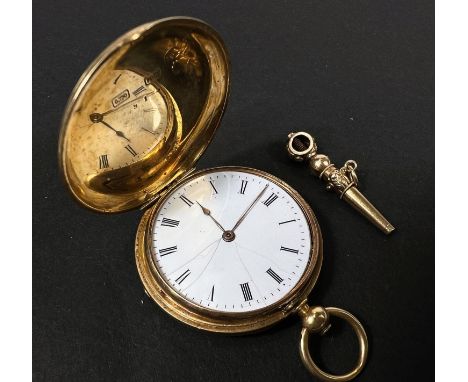 An 18 carat gold Patek Philippe small Hunter pocket watch with white dial, crest to front and monogram to reverse, with fob w