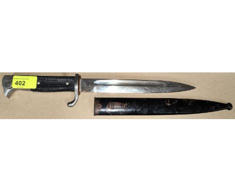 A German nickel plated bayonet with fullered blade stamped Solingen to blade, length 32cm with metal scabbard 